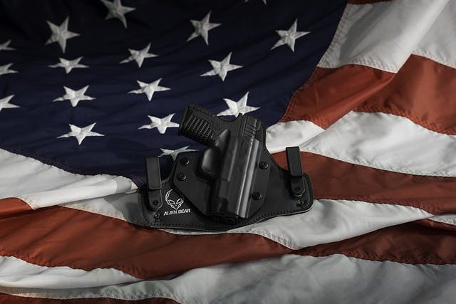 Handgun in a holster on the American flag