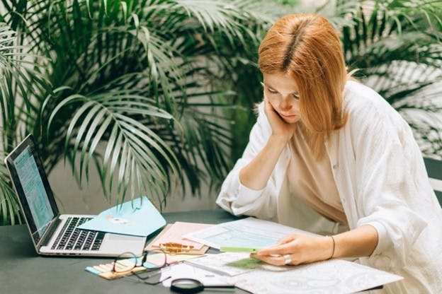 woman looking at papers