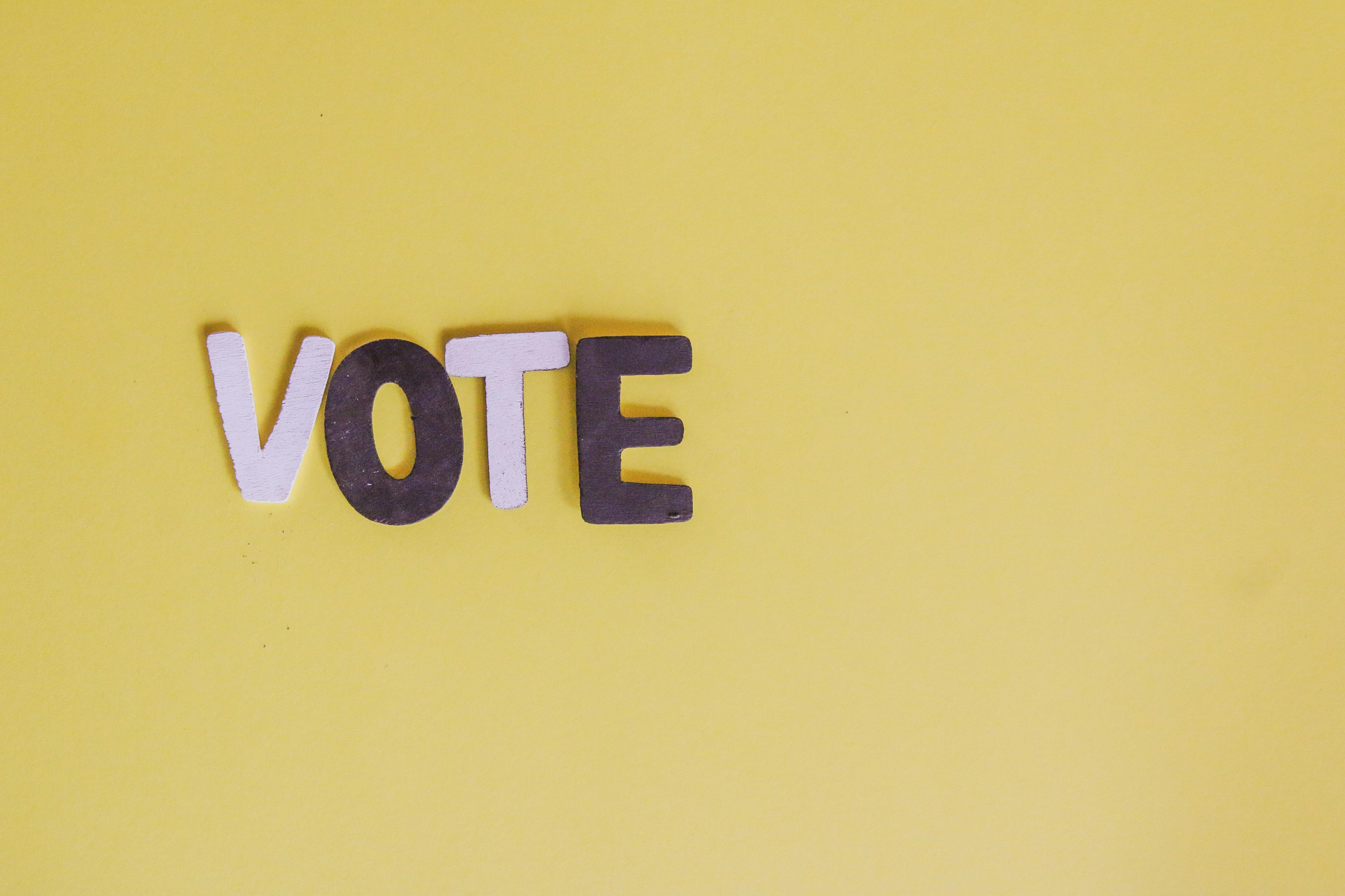 the word vote with a yellow background - Felony Disenfranchisement 