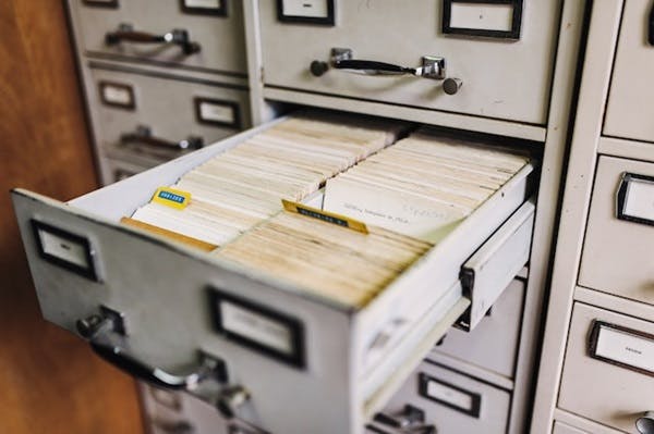 A filing cabinet with files