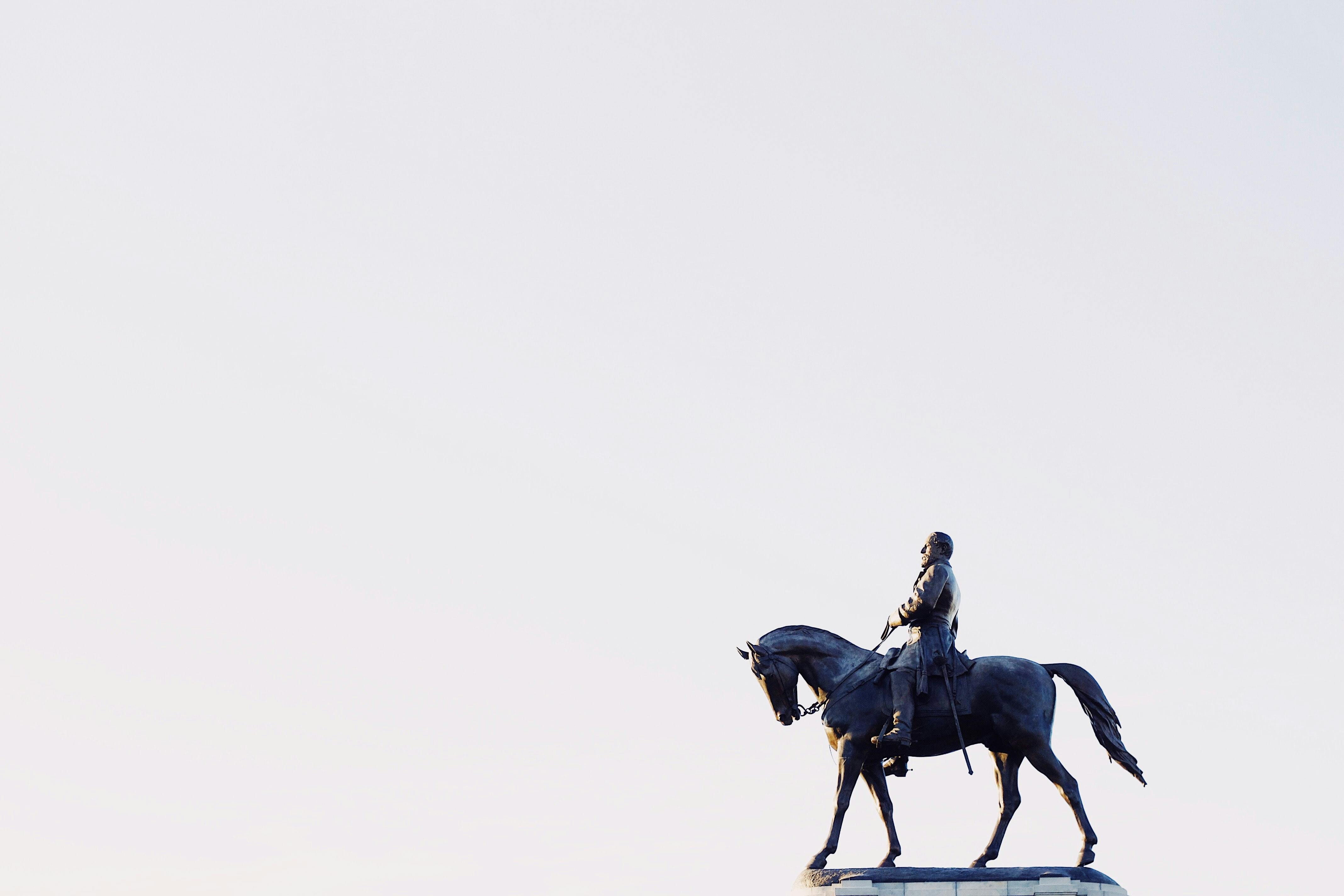 person on horse statue - Photo by Dean Hinnant on Unsplash