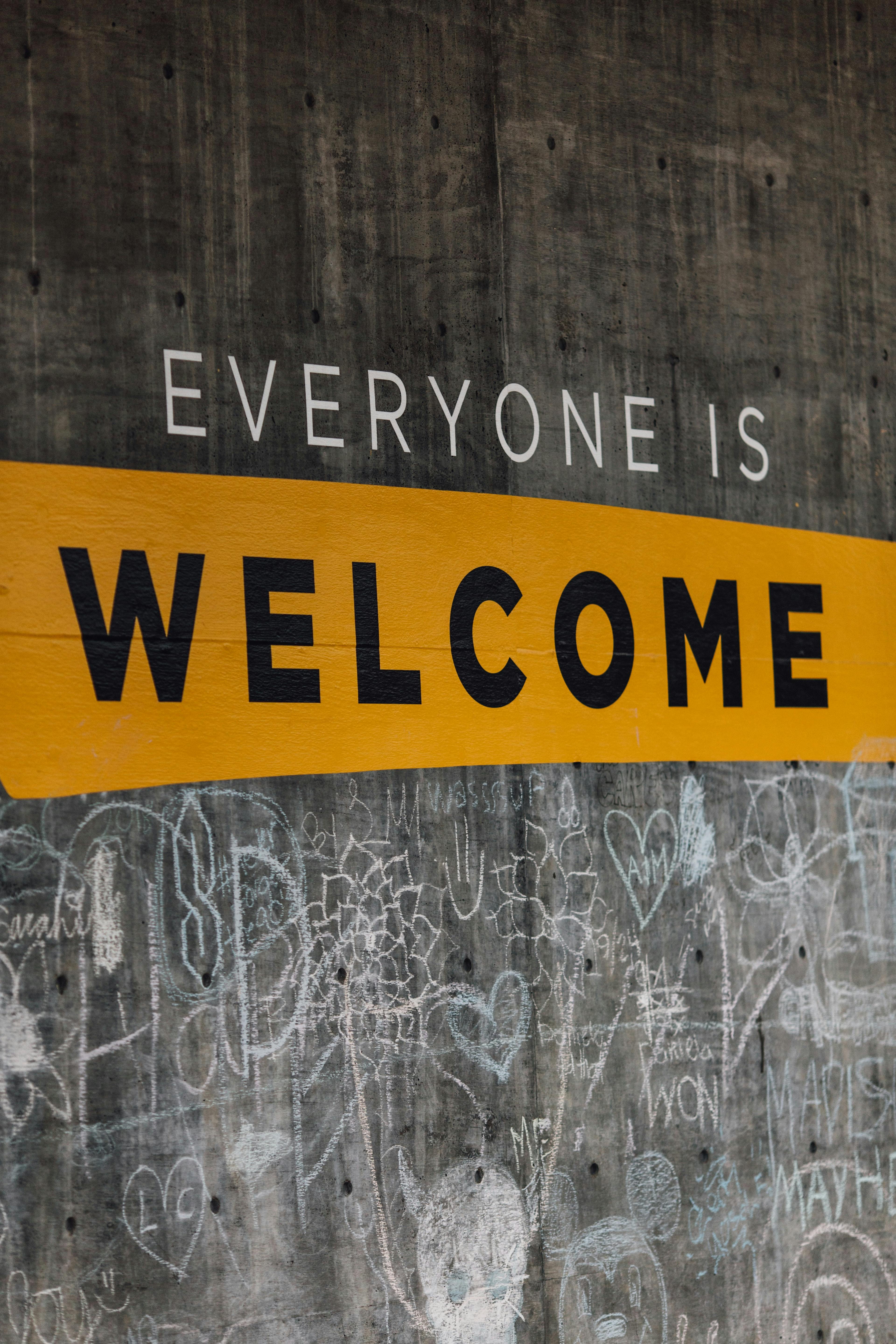 sign saying "everyone is welcome" - Photo by Katie Moum on Unsplash