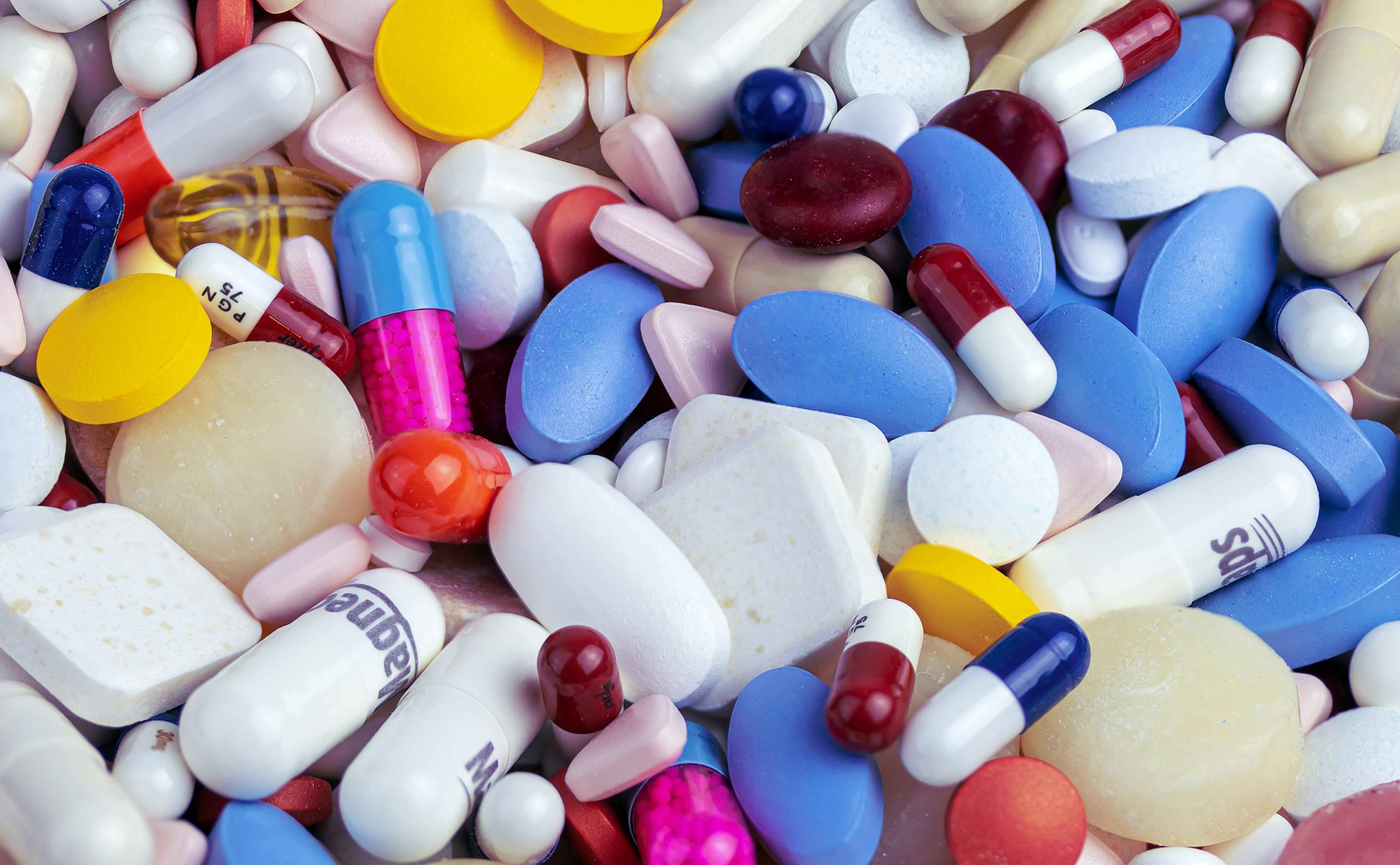 many different pills in a pile - Photo by Myriam Zilles on Unsplash