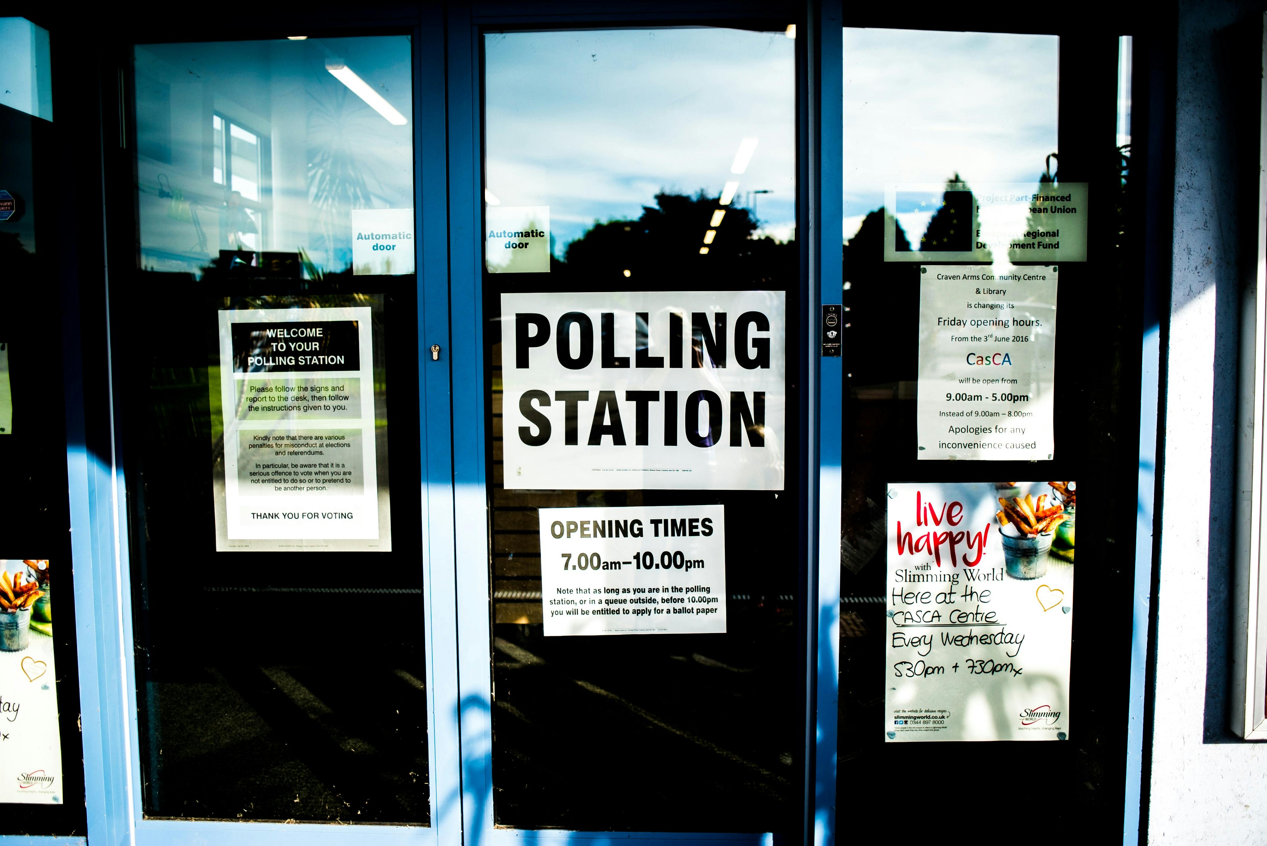 polling station sign - Photo by Elliott Stallion on Unsplash