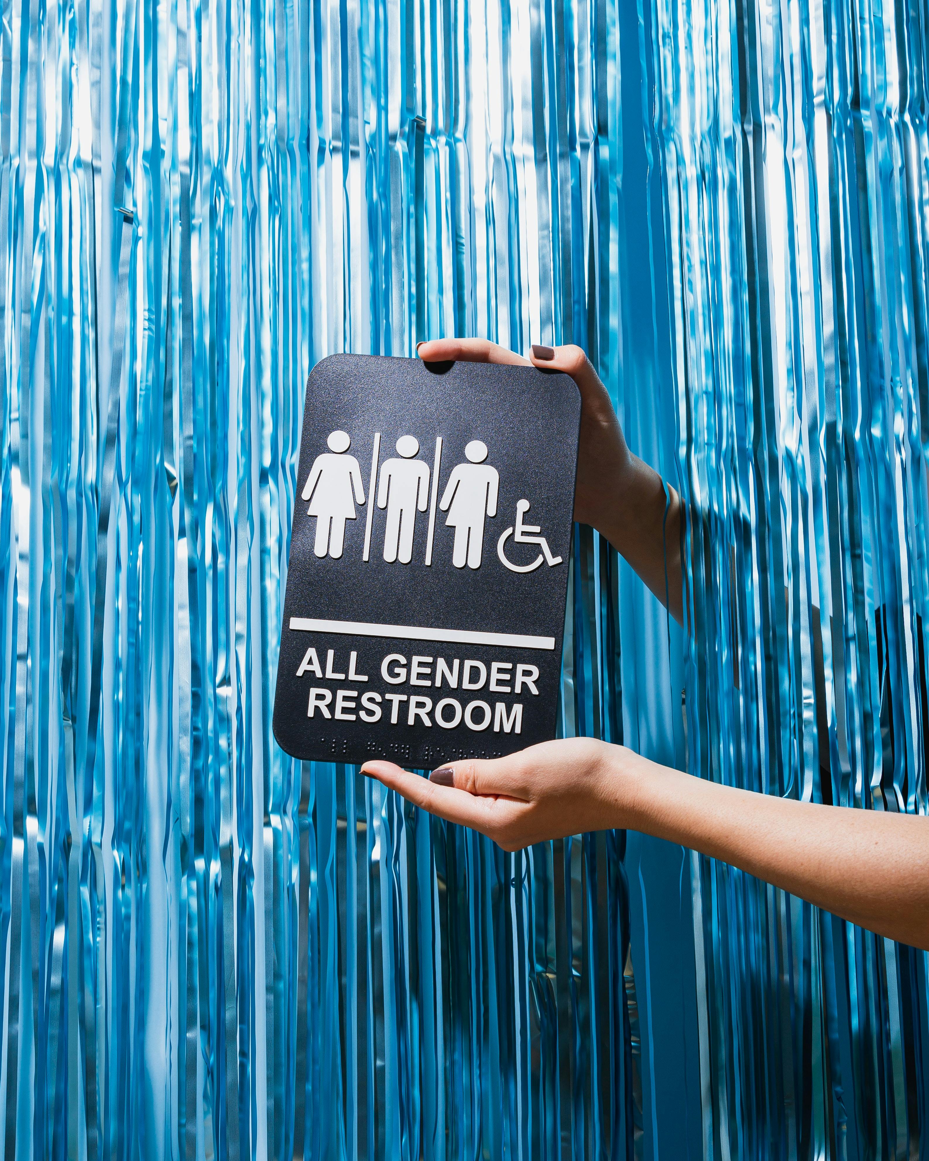 sign saying all gender restroom - Photo by No Revisions on Unsplash