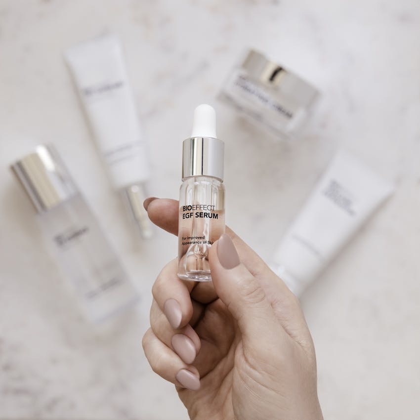 A bottle of the BIOEFFECT EGF Serum being held by a hand.