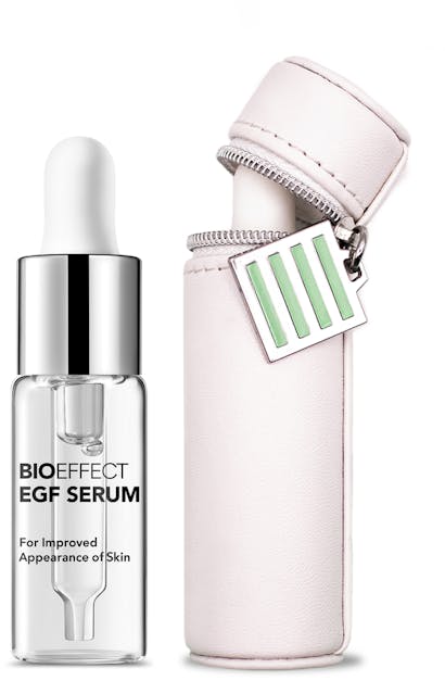 A white cylindrical case with a zipper top & the BIOEFFECT EGF Serum bottle is stored inside of it.