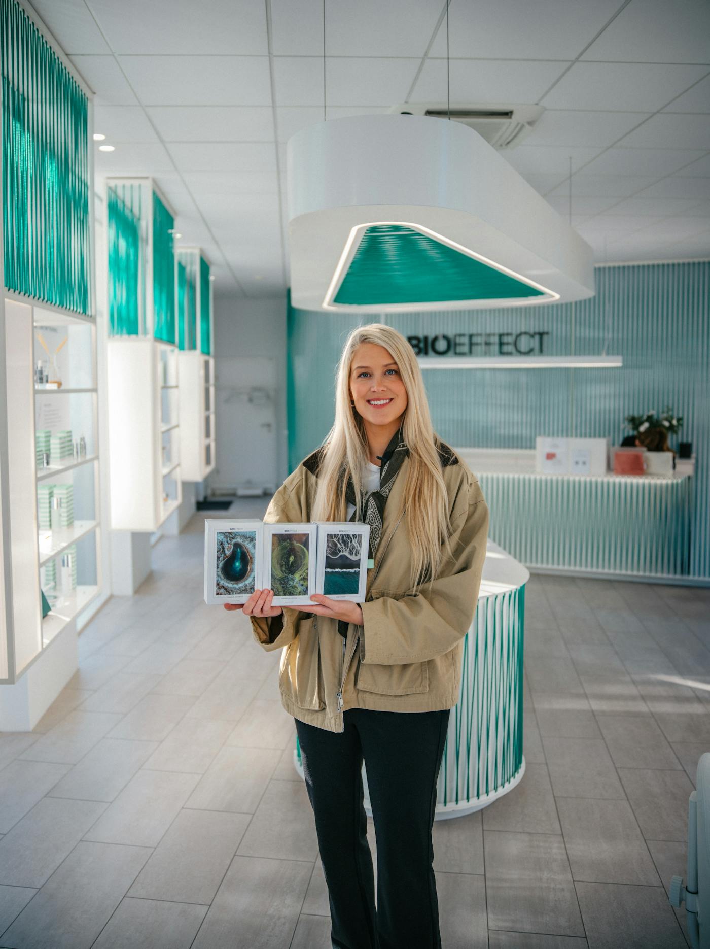 Ása photographer holding a holiday gift set