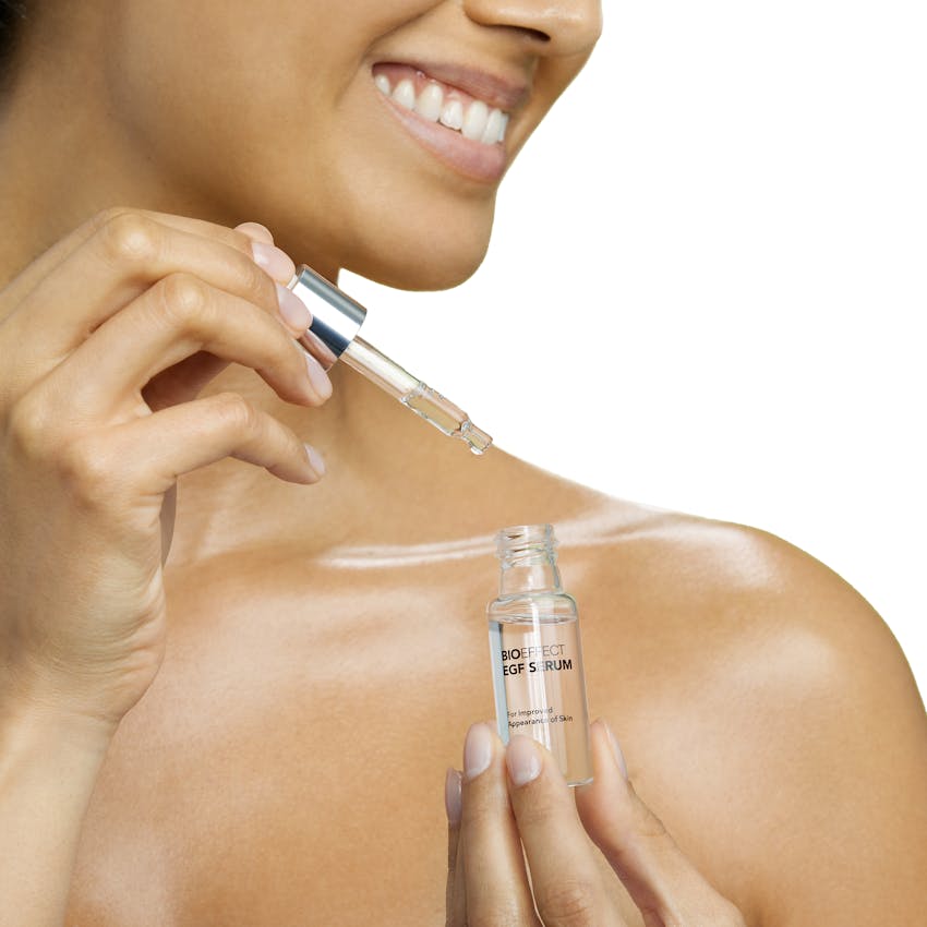 Woman Applying EGF Serum for Softer & Firmer Skin.