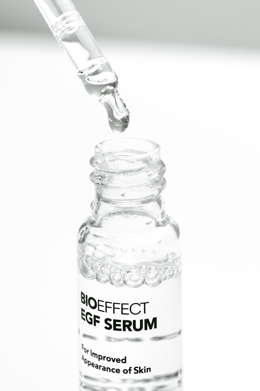 The glass dropper being removed from a bottle of BIOEFFECT EGF serum.