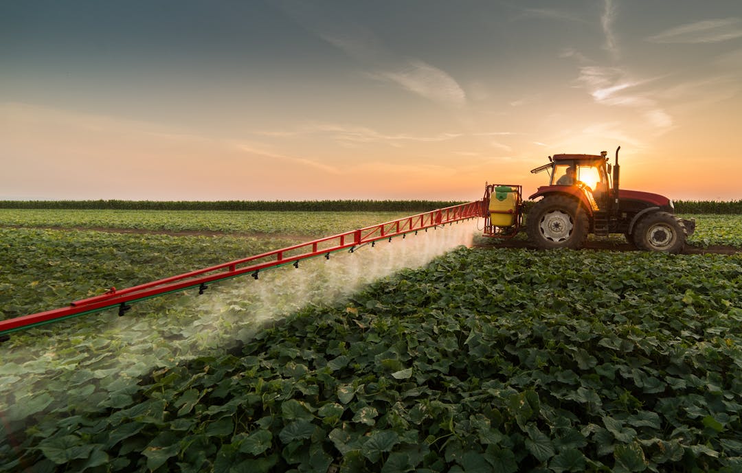 Large tractor rig spraying crop in Australia