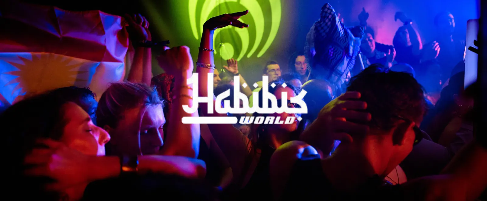 People dancing in the club, with the logo of Habibi's World