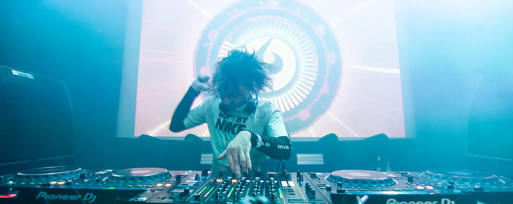 Explicit Rave DJ behind the decks