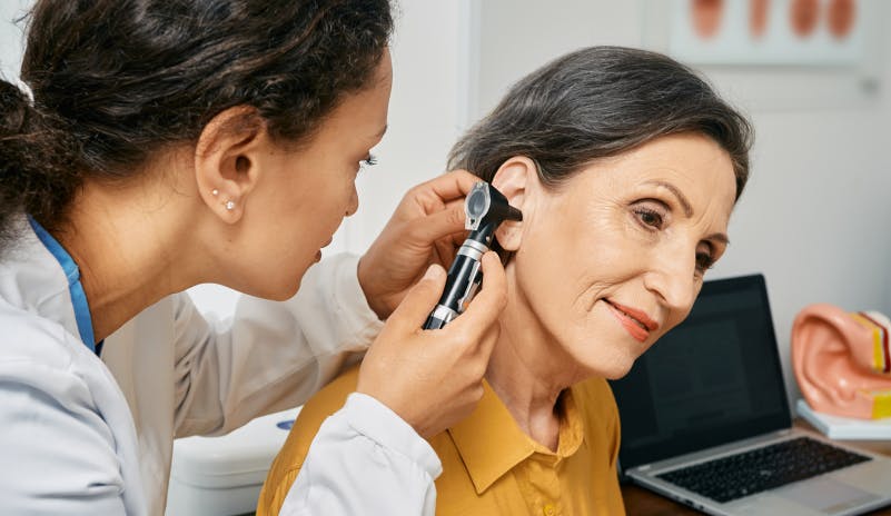 Audiologist assessing ear health