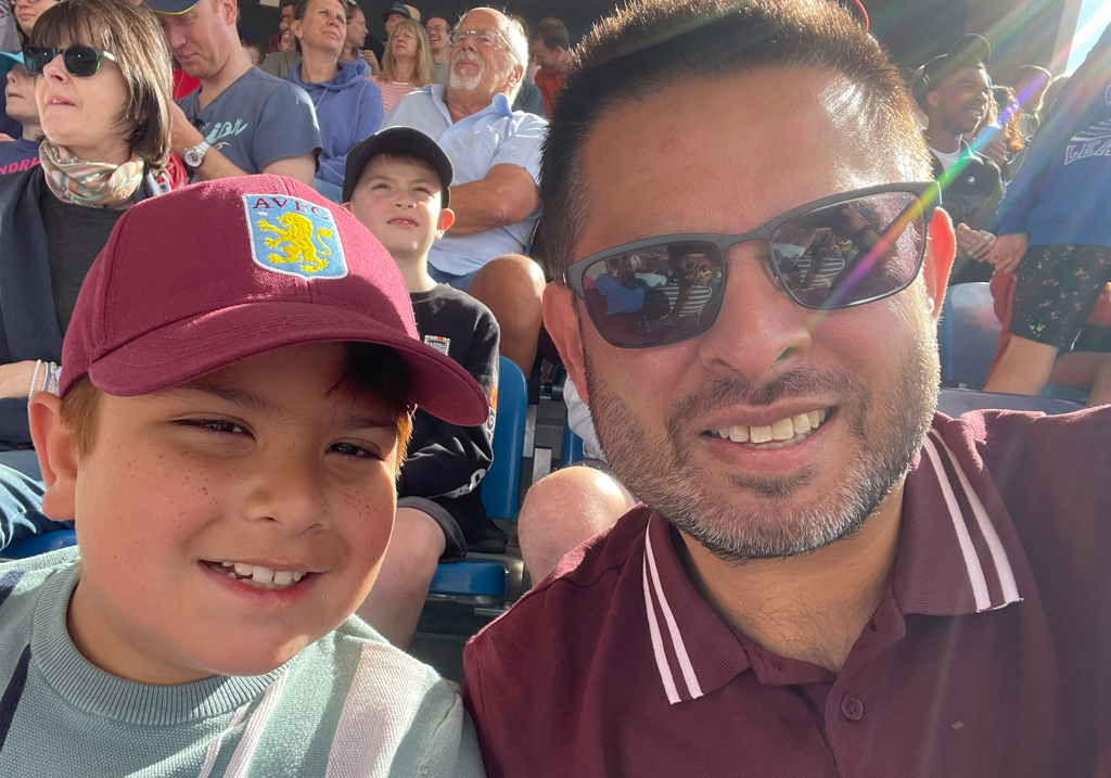 Councillor Waseem Zaffar and his son at an Aston Villa football match