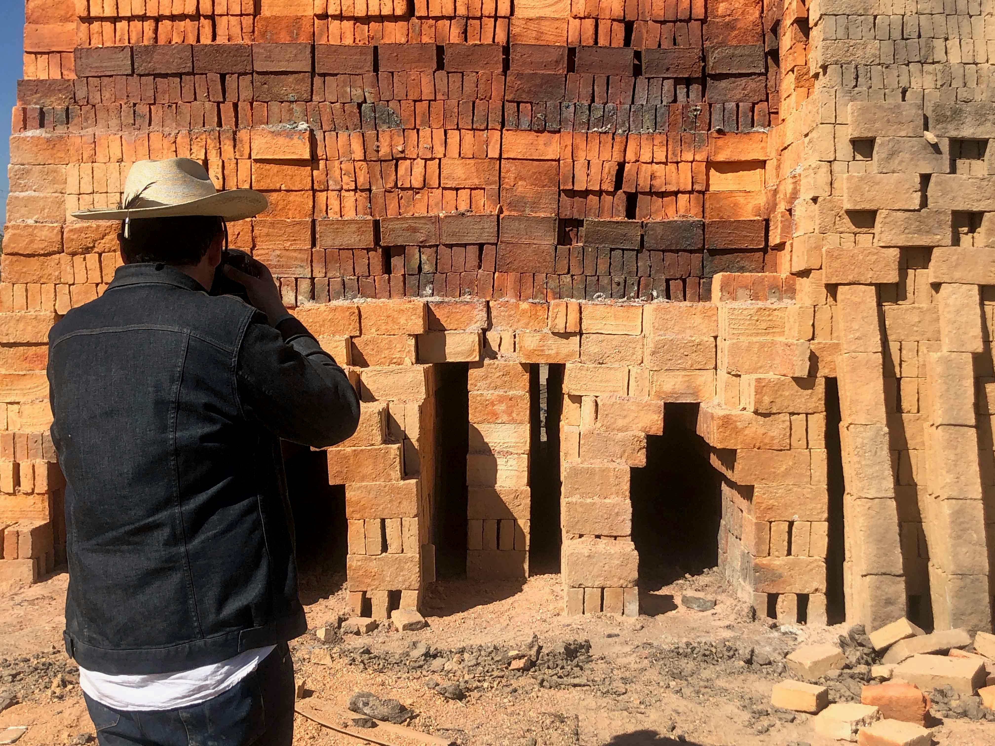 Alejandro Almanza Pereda photographing a kiln in Magdalena, Jalisco during film production.