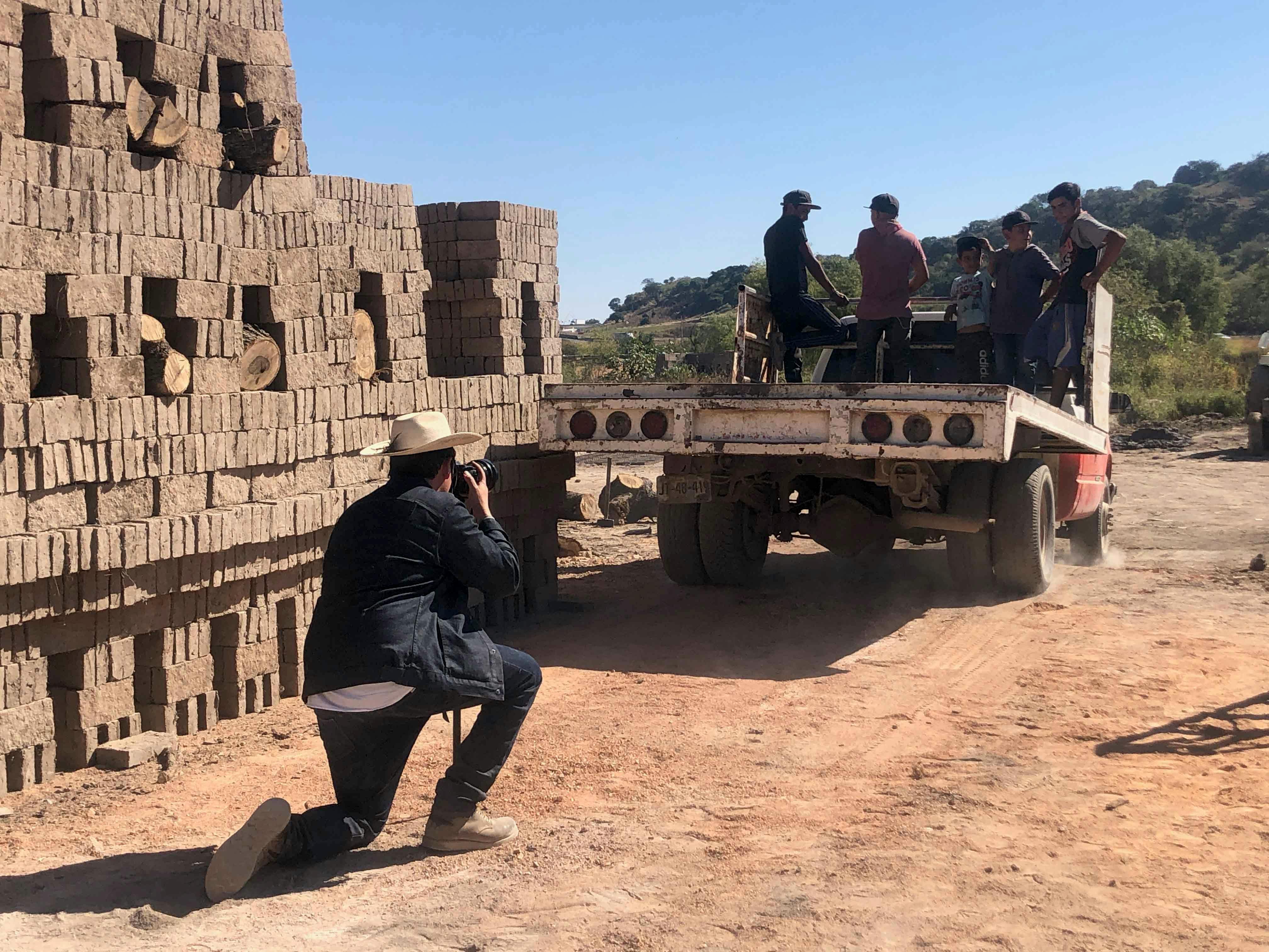 Almanza Pereda photographing the kiln assembly crew in Magdalena.