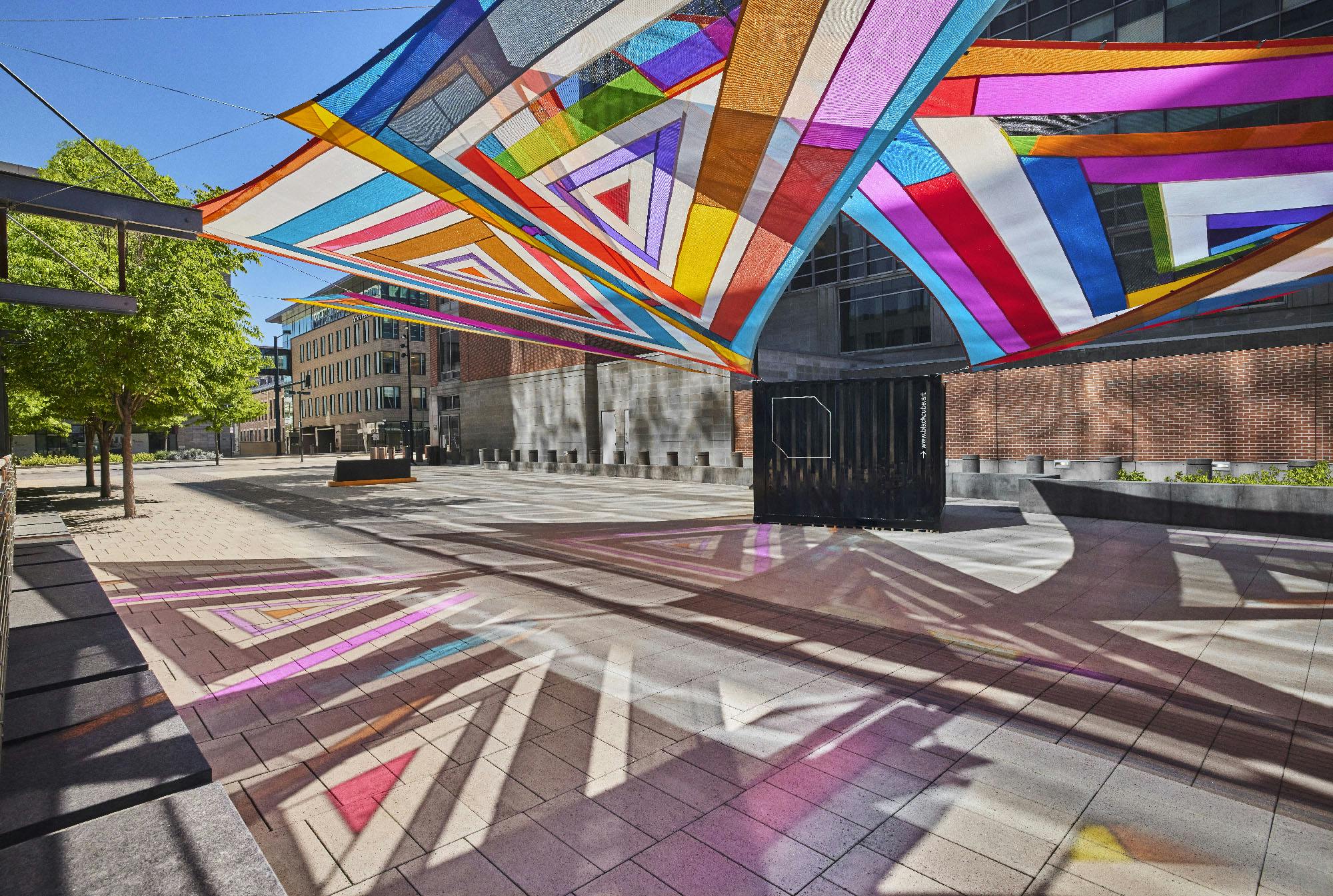 Rachel Hayes, Horizon Drift, 2024. Plaza of the Americas, Denver, Colorado. Site-specific installation composed of various industrial textiles, vinyl, and thread. Presented by the Biennial of the Americas with artistic direction by Black Cube Nomadic Art Museum. Courtesy the artist and Black Cube. Photo: Third Dune Productions.