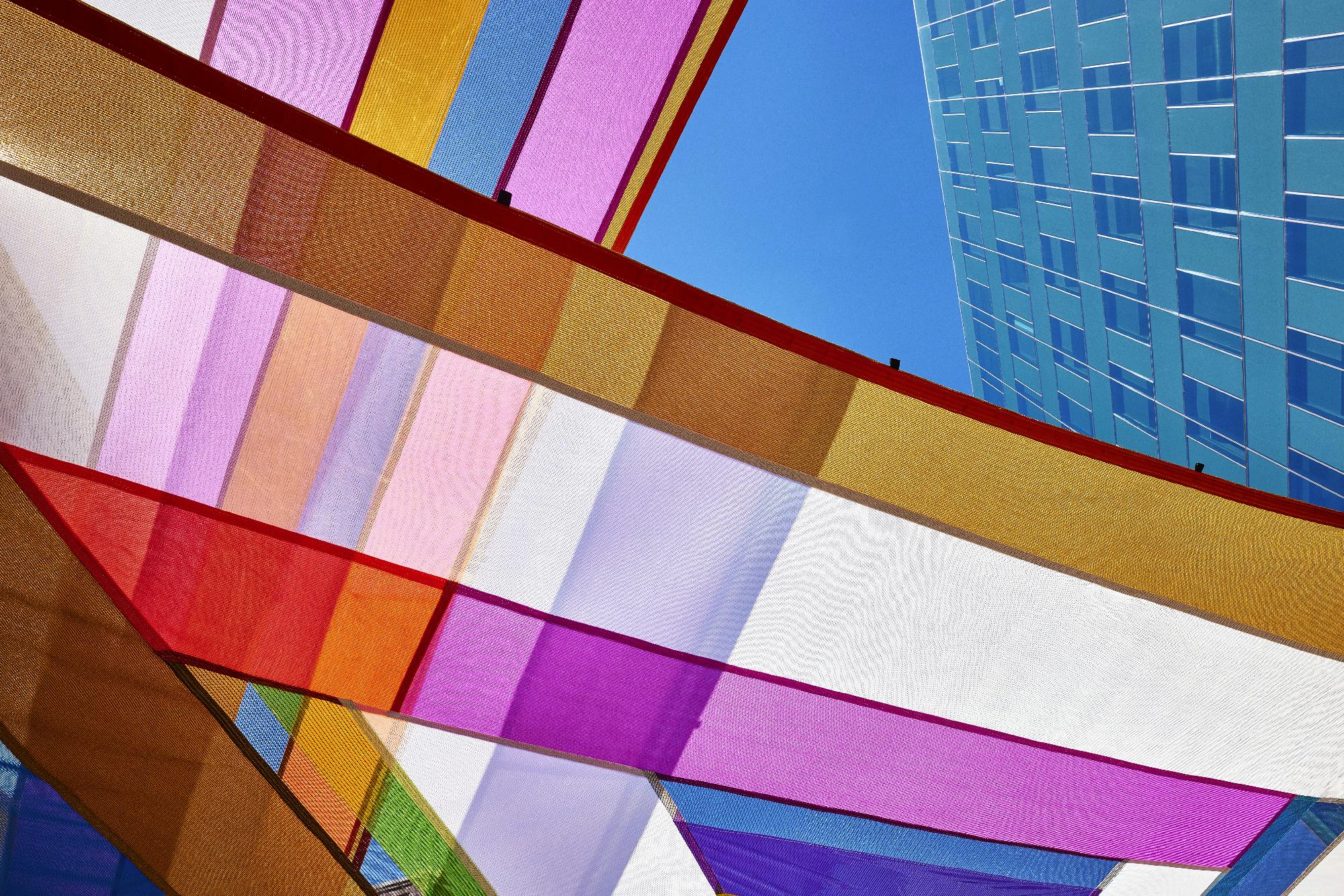 Rachel Hayes, Horizon Drift, 2024. Plaza of the Americas, Denver, Colorado. Site-specific installation composed of various industrial textiles, vinyl, and thread. Presented by the Biennial of the Americas with artistic direction by Black Cube Nomadic Art Museum. Courtesy the artist and Black Cube. Photo: Third Dune Productions.