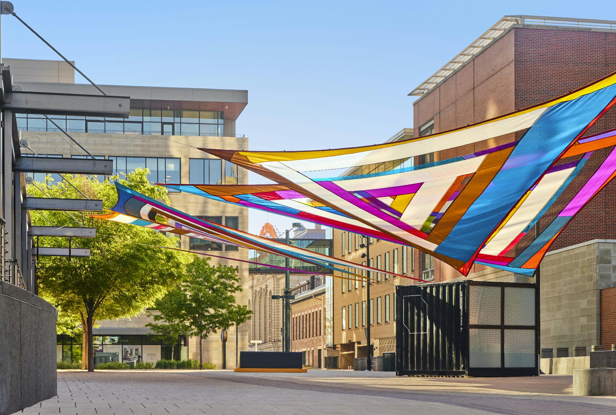 Rachel Hayes, Horizon Drift, 2024. Plaza of the Americas, Denver, Colorado. Site-specific installation composed of various industrial textiles, vinyl, and thread. Presented by the Biennial of the Americas with artistic direction by Black Cube Nomadic Art Museum. Courtesy the artist and Black Cube. Photo: Third Dune Productions.