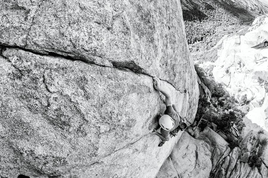 climber on a leaning finger crack (fallen arches)