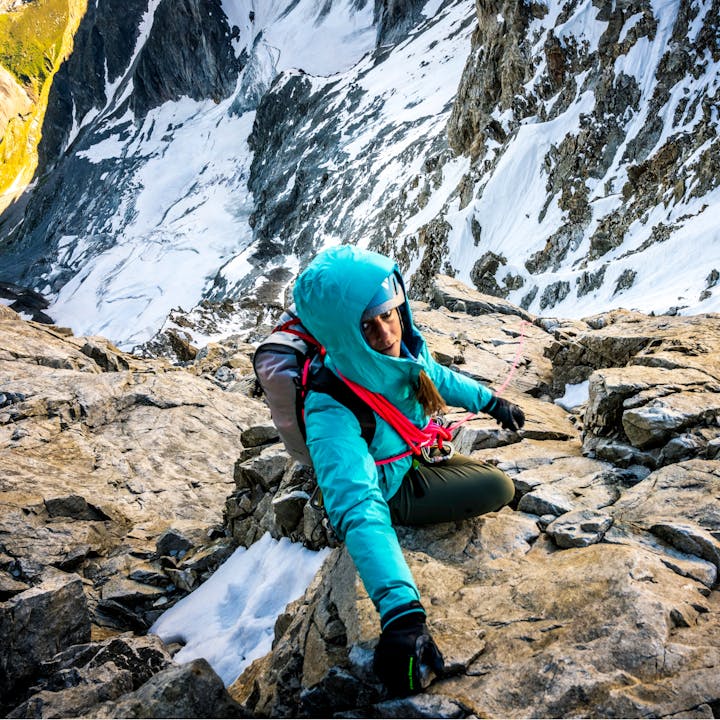 An alpine climber wearing the Black Diamond climbing gloves. 