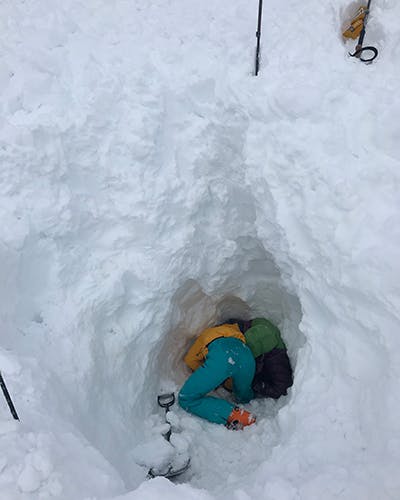 Snow Hole with woman buried in it. 