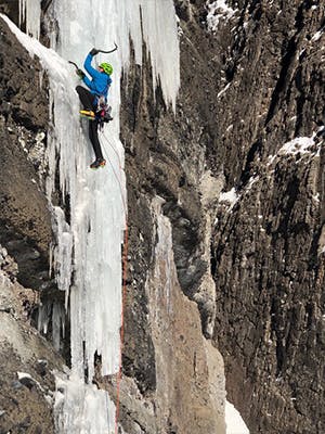 Photograph by Kolin Powick of Doug Chabot ice climbing in Montana