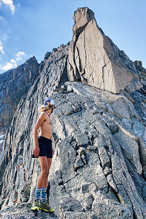 Kyle looking up at summit of Long Peak
