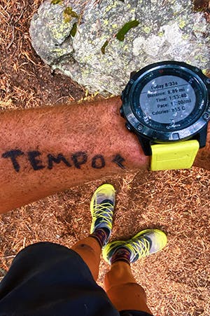 Kyle Richardson tempo writing on wrist for reminder.