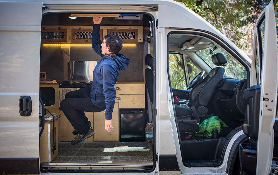 Alex Honnold hangboarding in his van