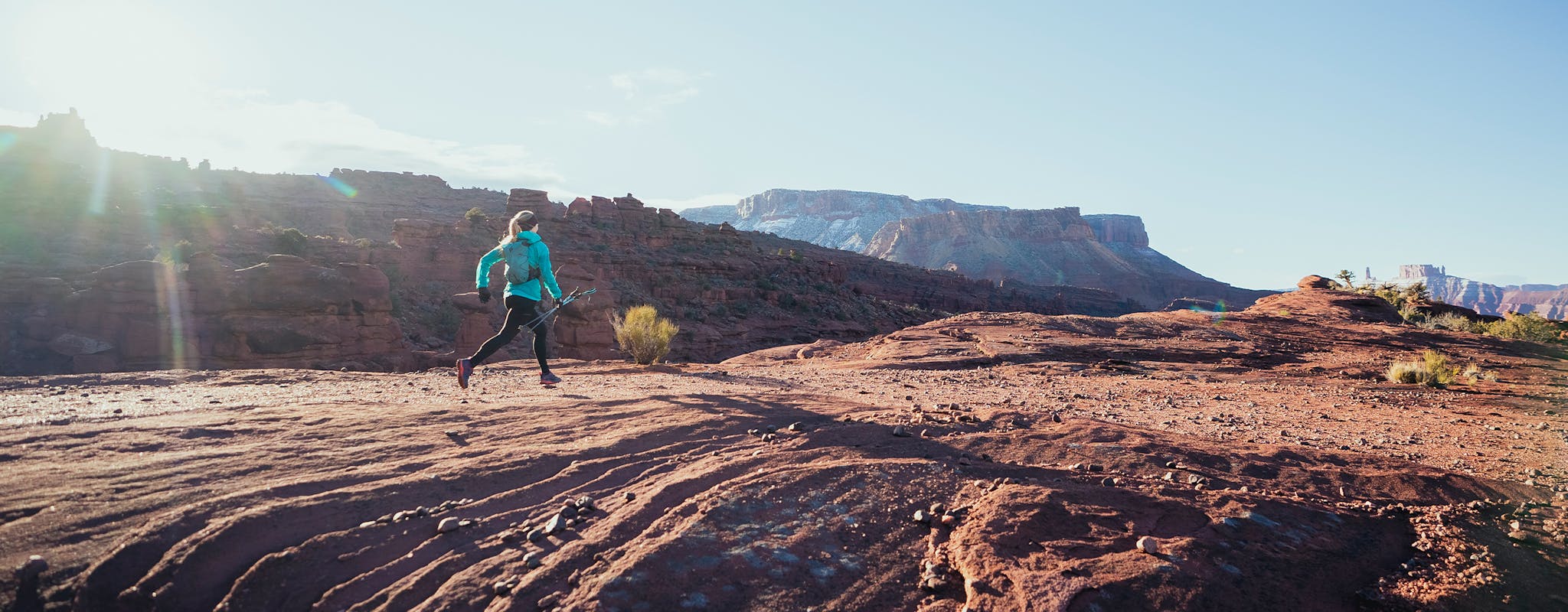 Black Diamond Athlete Kelly Halpin running in Moab. 