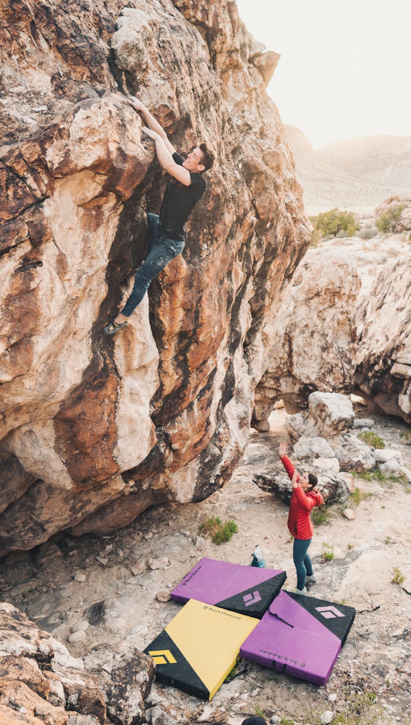 Black Diamond athlete bouldering above the Circuit Crash Pad.