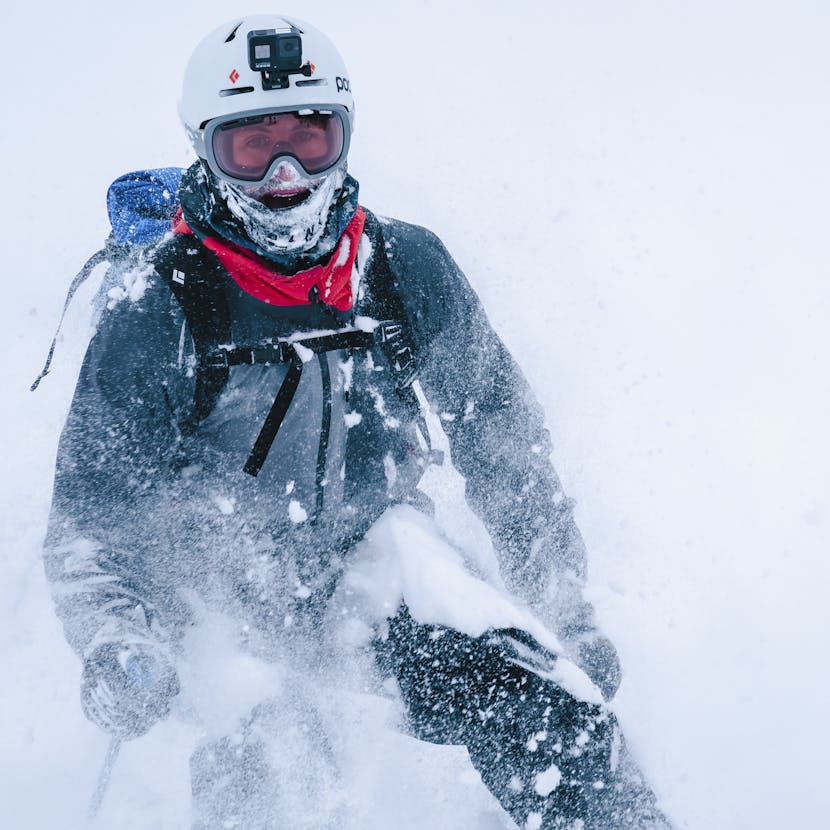 Black Diamond Athlete Isaac Freeland with a smile on his face after skiing some pow.