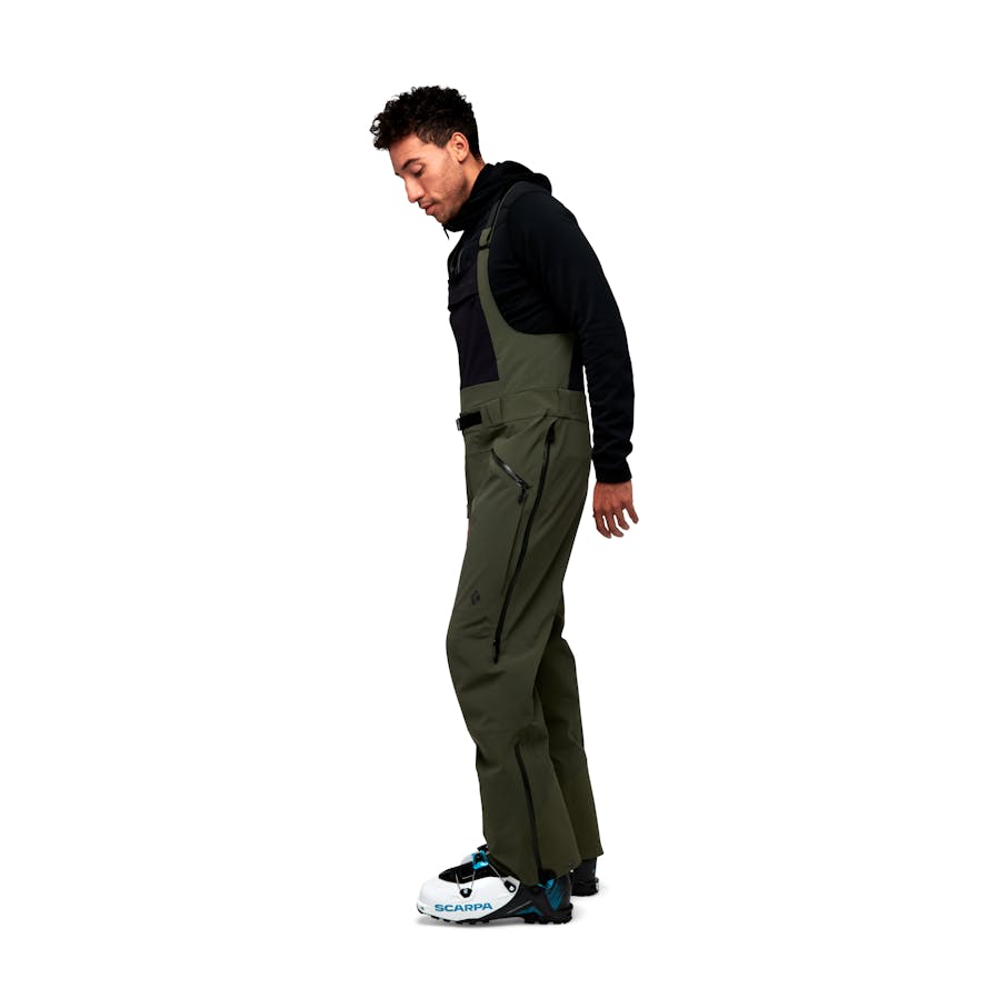 Side view of a model wearing the Recon Stretch Bibs.