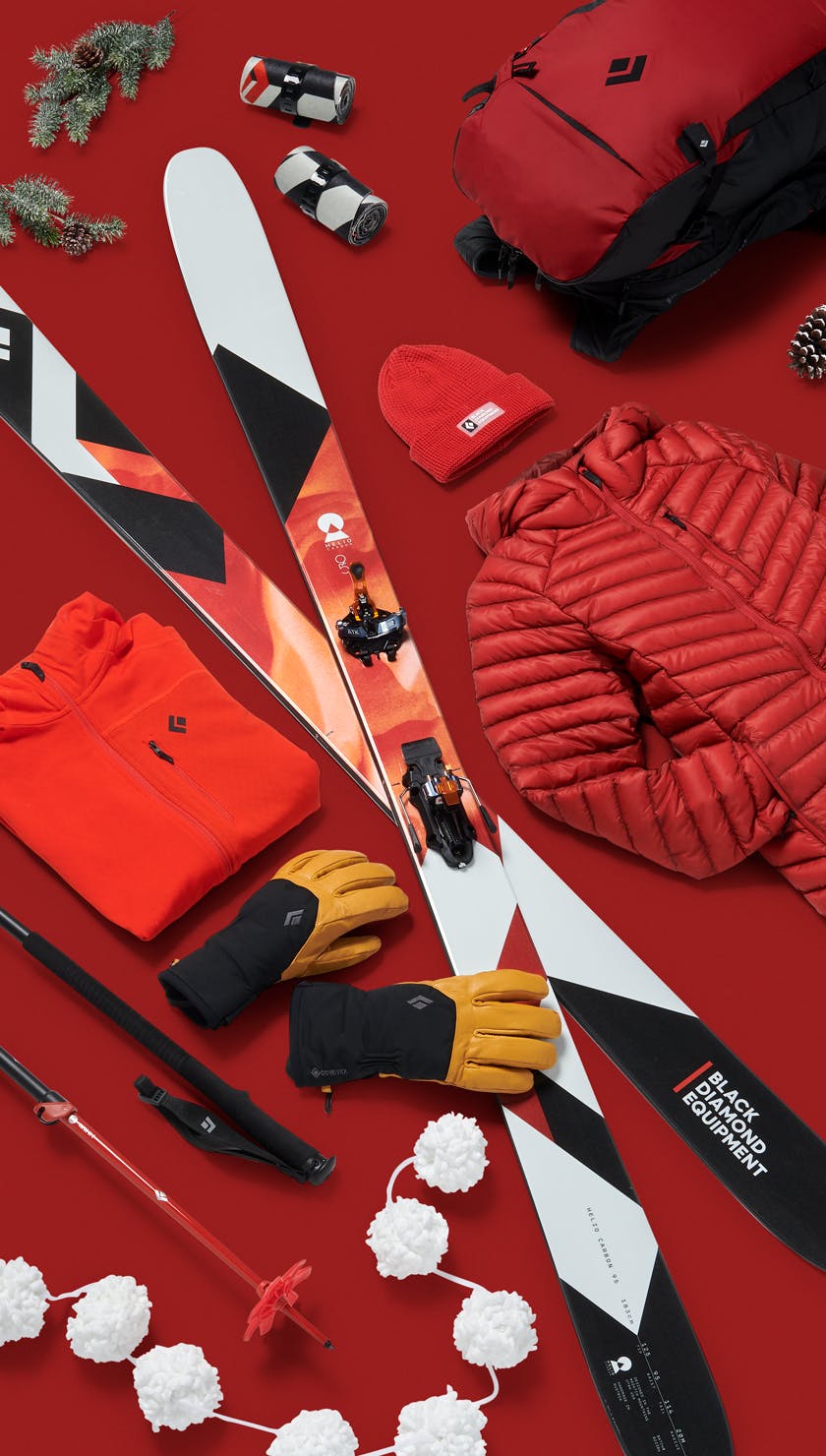 A lay down image of a Black Diamond Ski kit with a red holiday theme.  