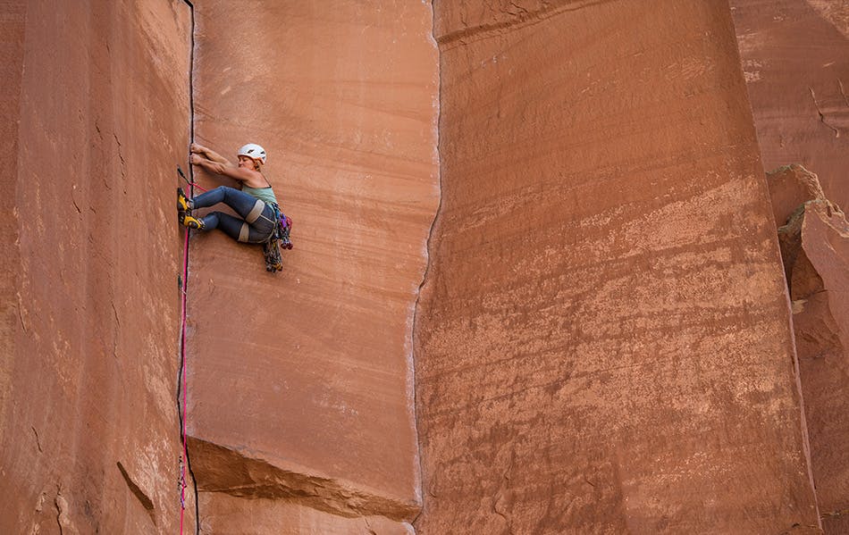 Photograph by Andy Earl of Hazel Findlay climbing outdoors in Southern Utah