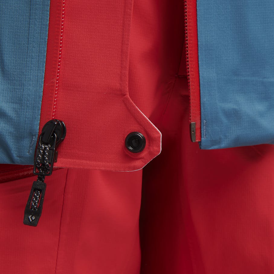 Ventilated draft flap at mouth with snap tab to secure jacket when worn open for thermal regulation