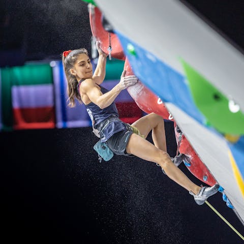 Black Diamond Athlete Natalia Grossman bouldering in a gym. Photo by Jan Virt.