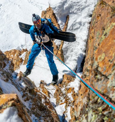 A portrait of Black Diamond ambassador Mike Meru on rappel in the backcountry.