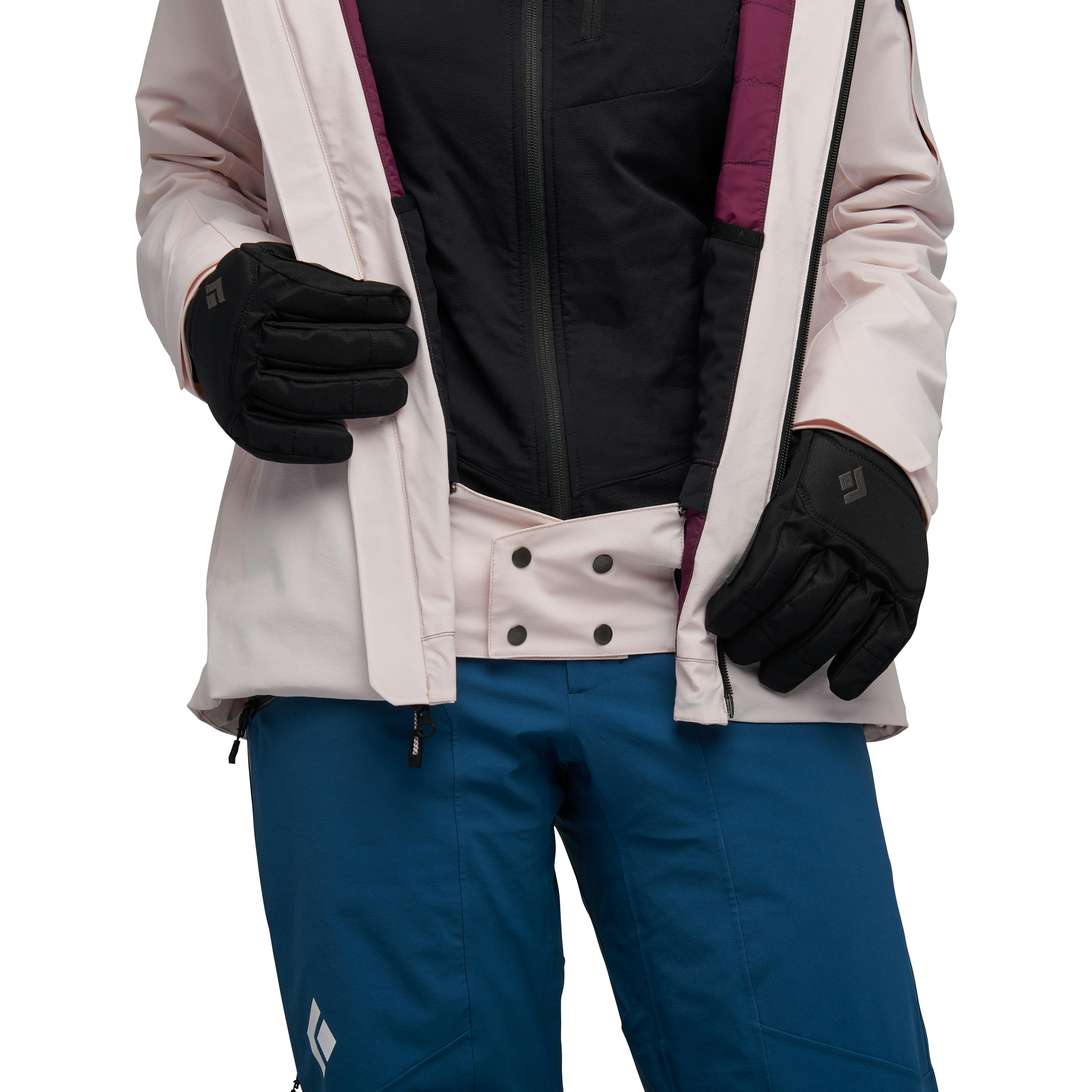 A model adjusts the open of her pink Recon Insulated Jacket