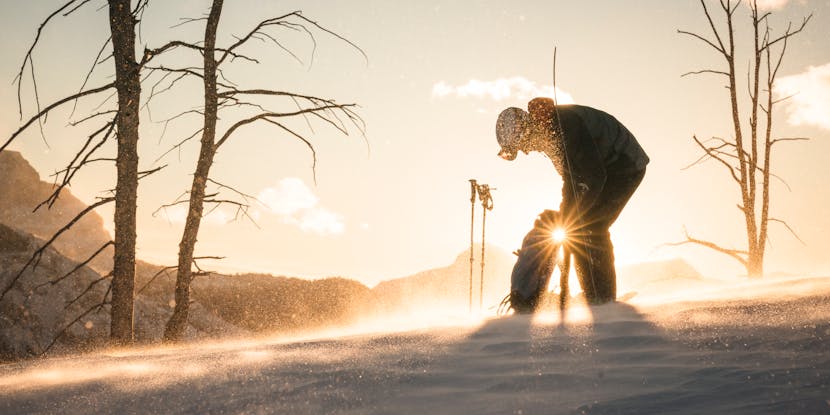 Black Diamond Athlete Isaac Freeland packing his backpack during a tour.