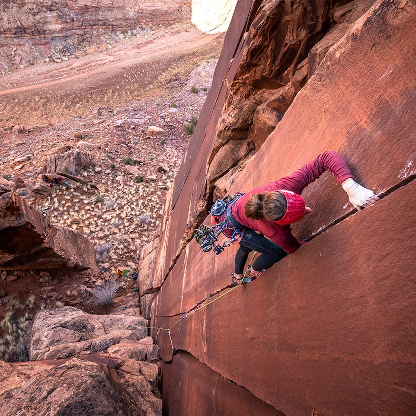 woman climbing a crack