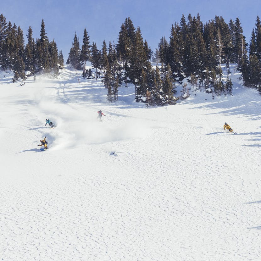 Black Diamond Athletes enjoying powder turns together in Crested Butte, CO.