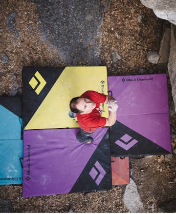 Black Diamond athlete Carlo Traversi stands on Circuit Crash pads eyeing his project.