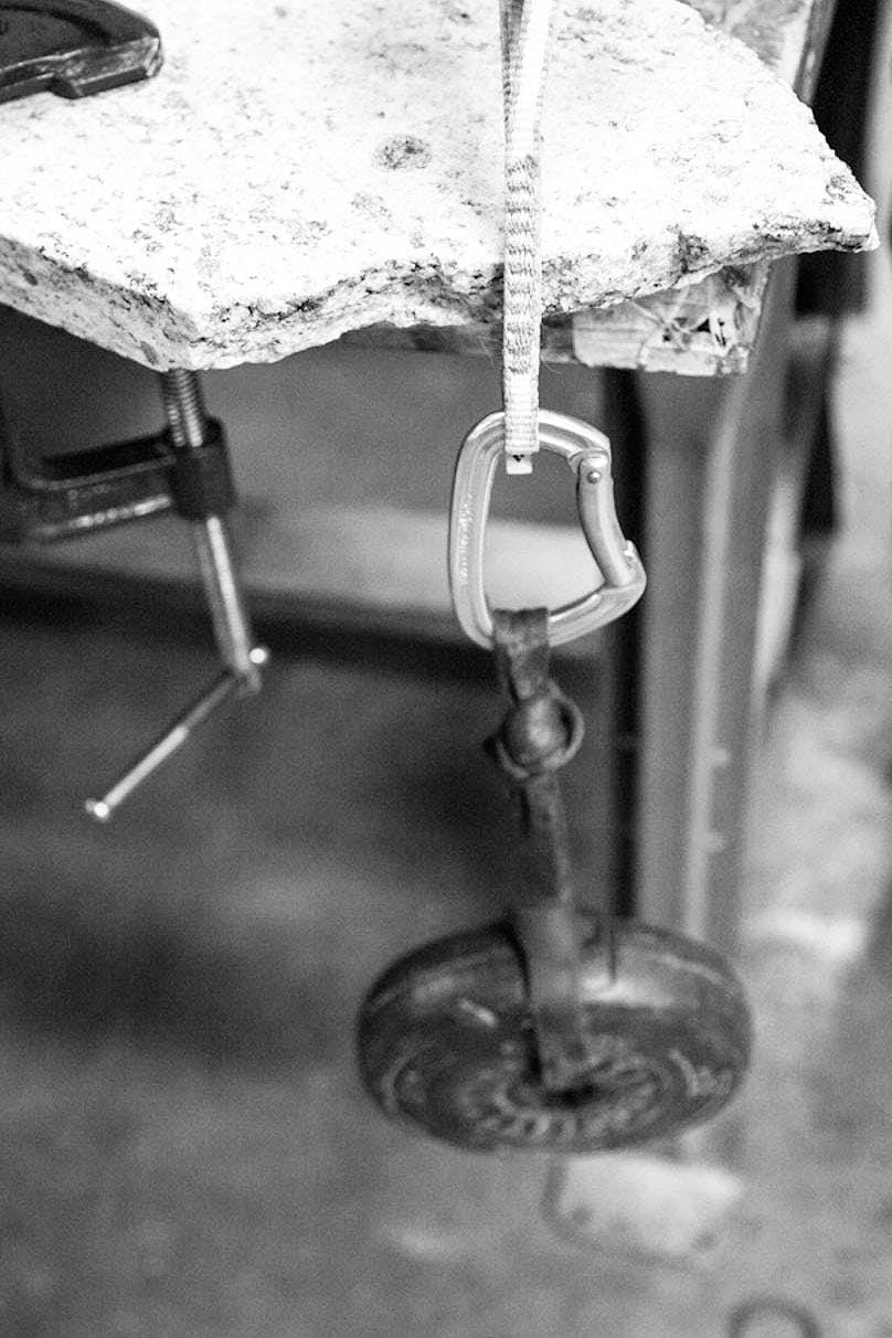 weight hanging from quickdraw to test the strength.