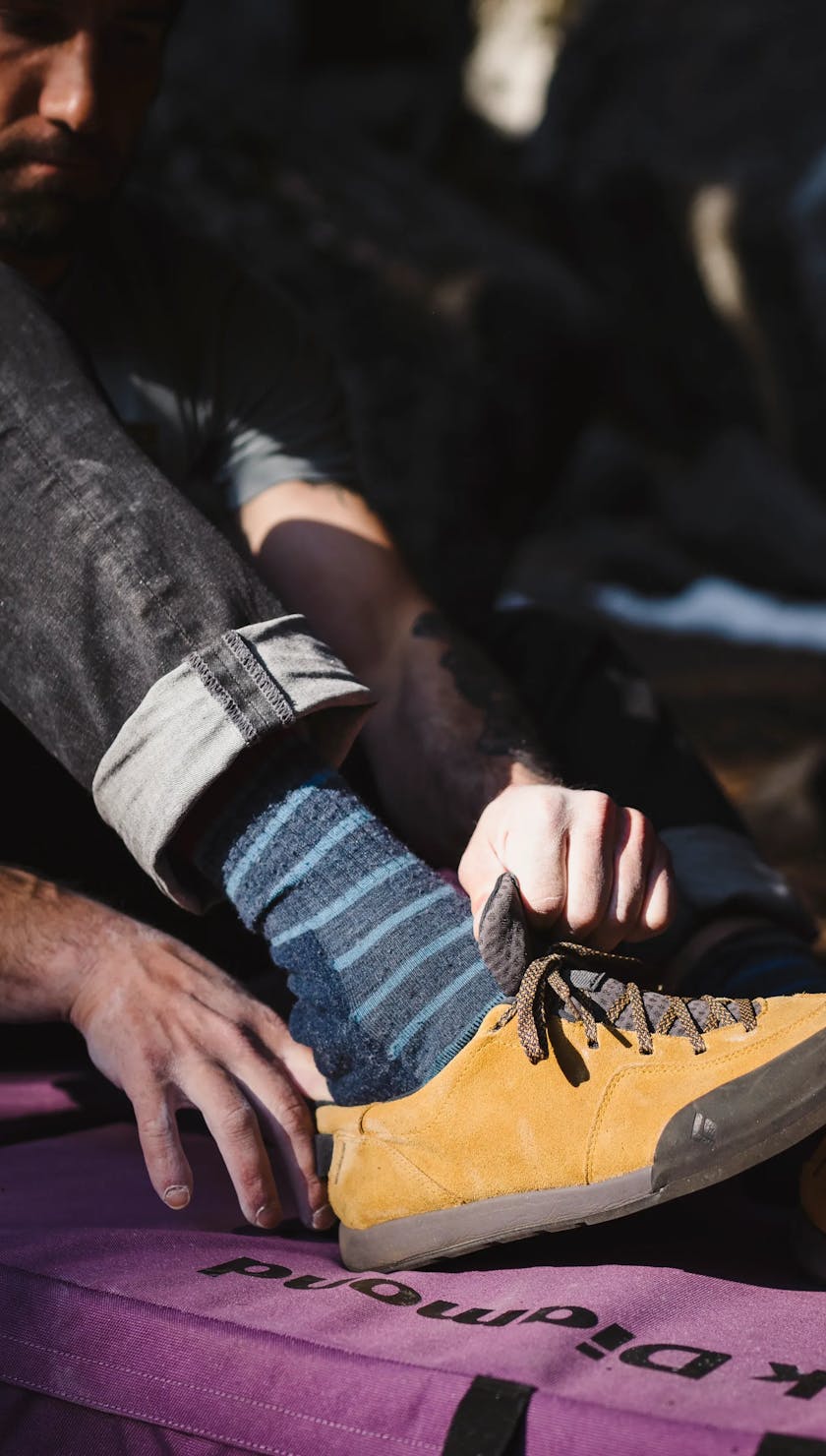 Man putting on his approach shoes
