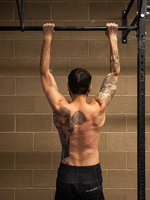 Photo of Sam Elias in mid pull up.