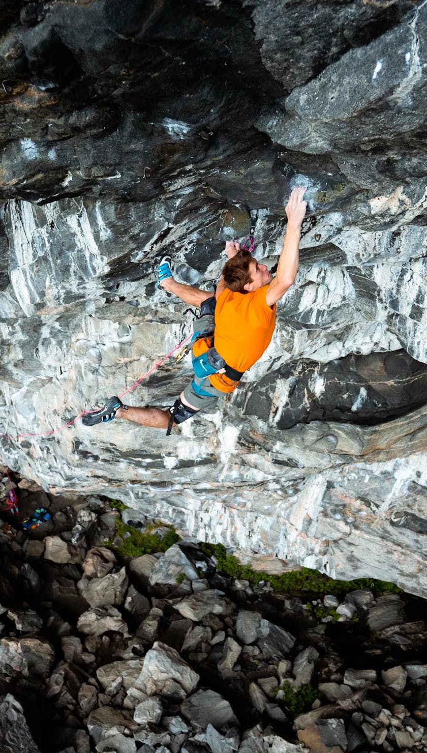 BD Athlete Seb Bouin climbing on rock 