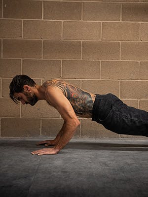 Profile photo of Sam Elias in mid pushup.